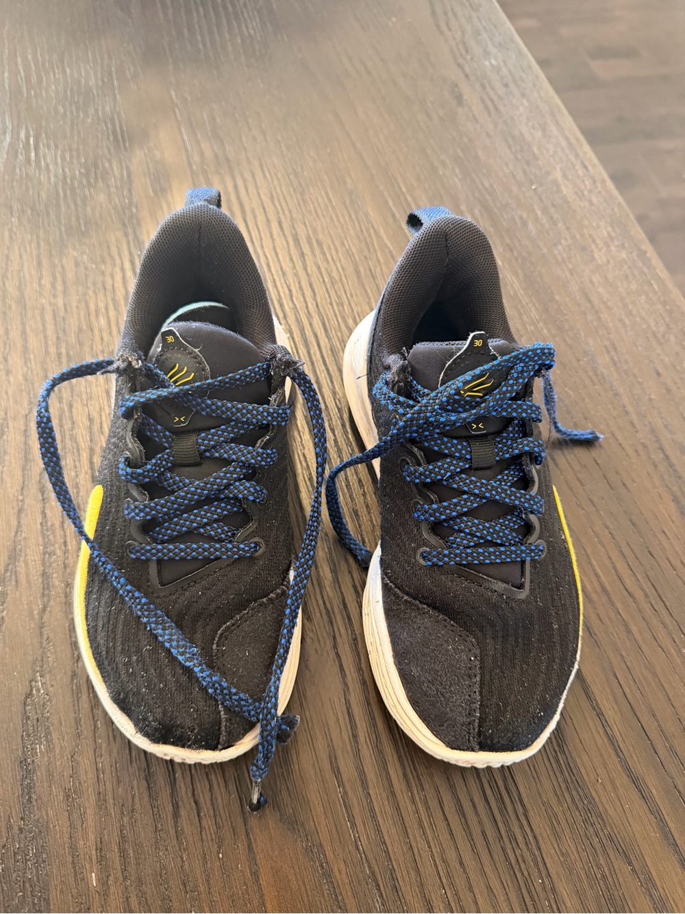 Under Armour Black Sneakers with Blue Laces and Yellow Accent